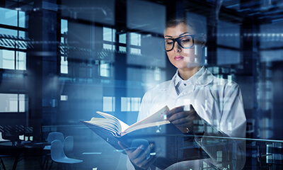 Scientist reading about epigenetics.